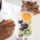 Medical professional holding a vitamin-infused IV bag with fruits inside representing IV Hydration in Kenai, AK