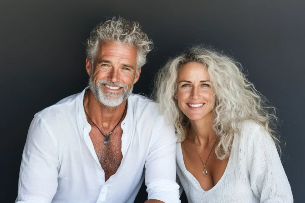 A happy and vibrant mature couple, representing renewed vitality and well-being achieved through Hormone Replacement Therapy at Cheeky Medspa