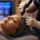 Professional administering microneedling for acne scars on a patient’s forehead using a SkinPen device.
